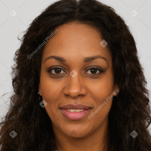 Joyful black young-adult female with long  brown hair and brown eyes