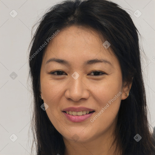 Joyful asian young-adult female with long  brown hair and brown eyes