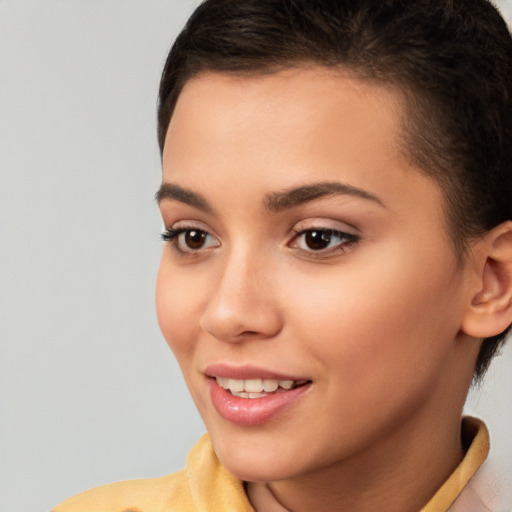 Joyful white young-adult female with short  brown hair and brown eyes