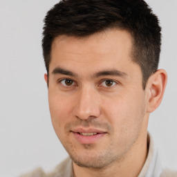 Joyful white young-adult male with short  brown hair and brown eyes