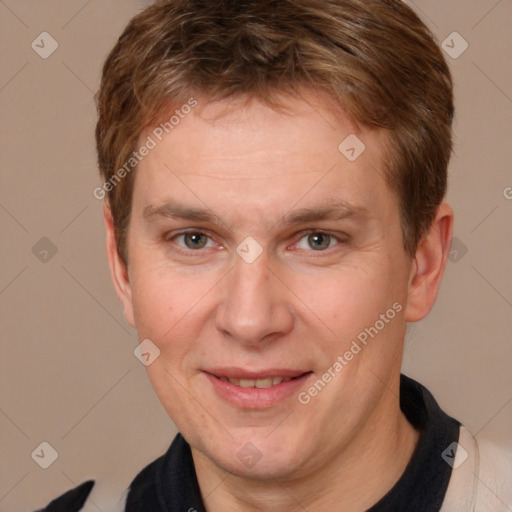 Joyful white adult male with short  brown hair and brown eyes