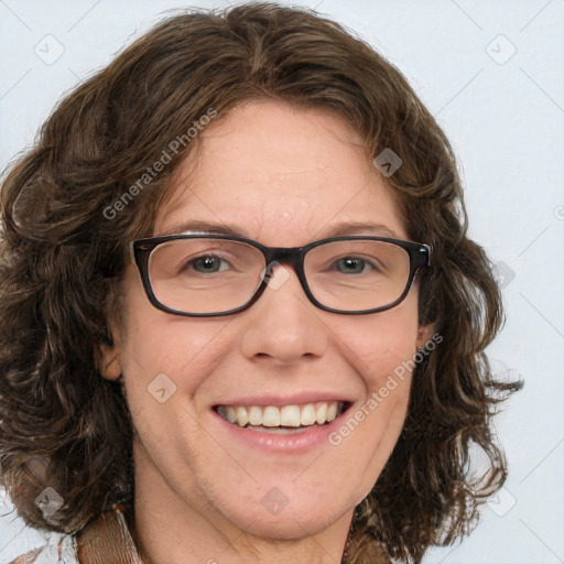 Joyful white adult female with medium  brown hair and blue eyes