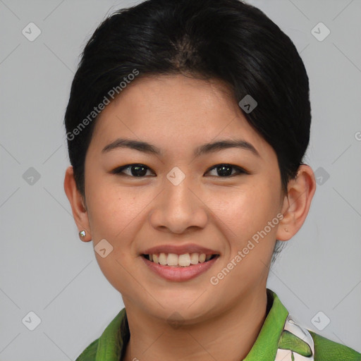 Joyful asian young-adult female with short  brown hair and brown eyes