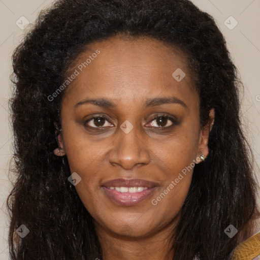 Joyful black young-adult female with long  brown hair and brown eyes