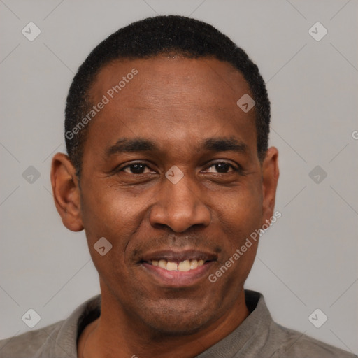 Joyful latino adult male with short  black hair and brown eyes