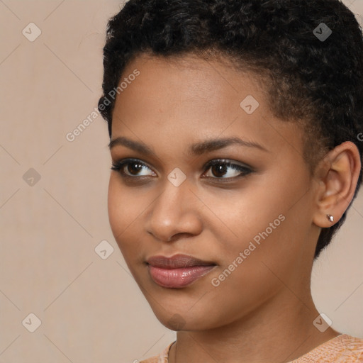 Joyful black young-adult female with short  brown hair and brown eyes