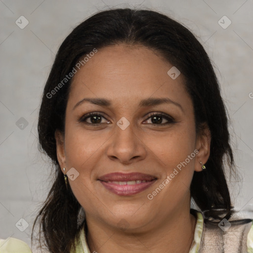 Joyful latino adult female with medium  brown hair and brown eyes