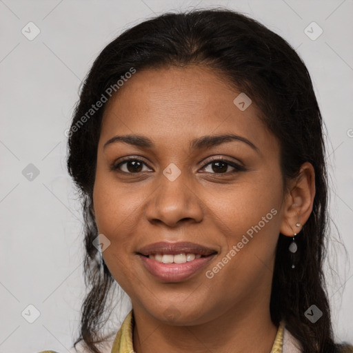 Joyful latino young-adult female with long  brown hair and brown eyes