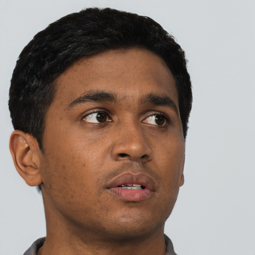 Neutral black young-adult male with short  black hair and brown eyes