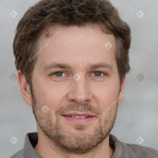 Joyful white adult male with short  brown hair and grey eyes