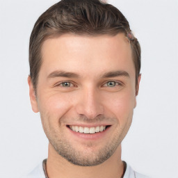 Joyful white young-adult male with short  brown hair and brown eyes