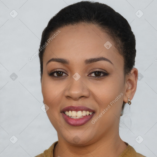 Joyful latino young-adult female with short  brown hair and brown eyes