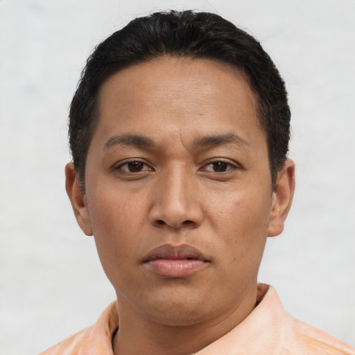 Neutral latino adult male with short  black hair and brown eyes