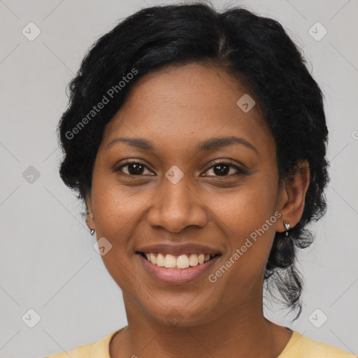 Joyful black adult female with short  black hair and brown eyes