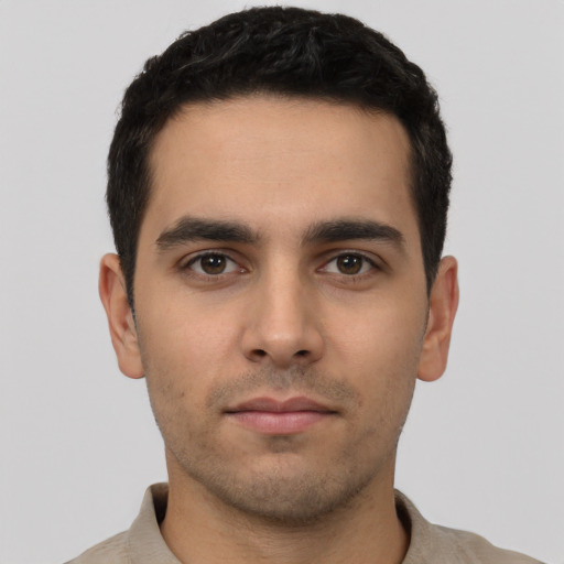 Neutral white young-adult male with short  black hair and brown eyes