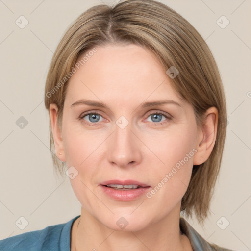 Joyful white adult female with medium  brown hair and blue eyes