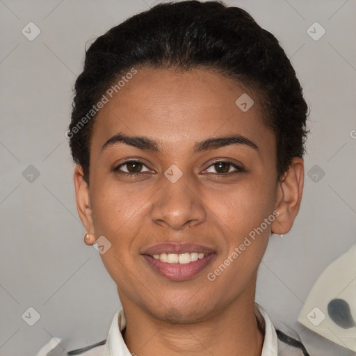 Joyful latino young-adult female with short  brown hair and brown eyes