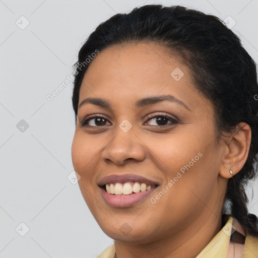 Joyful latino young-adult female with long  black hair and brown eyes