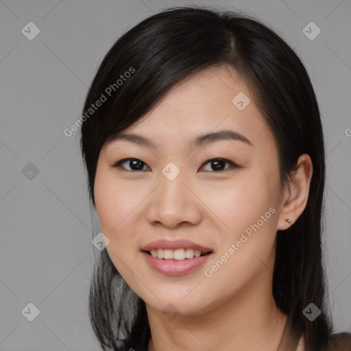 Joyful asian young-adult female with medium  black hair and brown eyes