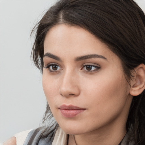 Neutral white young-adult female with long  brown hair and brown eyes