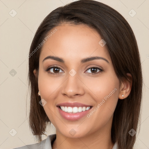 Joyful white young-adult female with long  brown hair and brown eyes