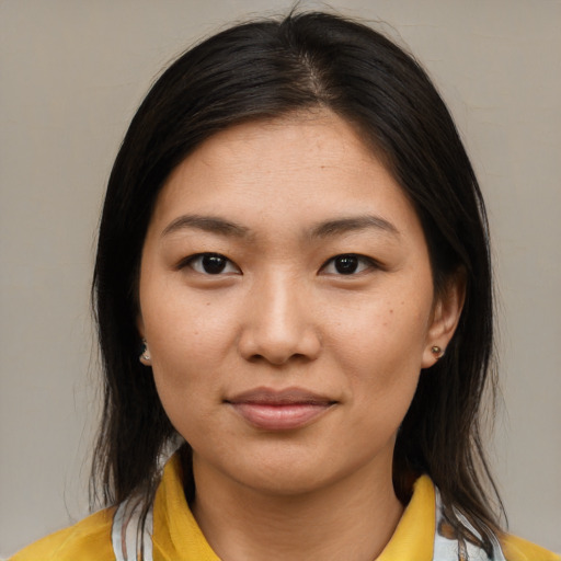 Joyful white young-adult female with medium  brown hair and brown eyes