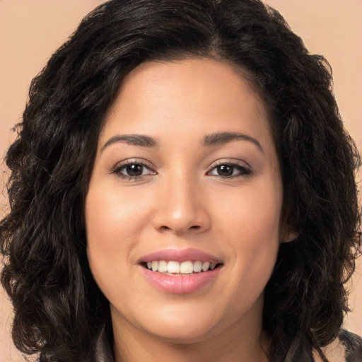 Joyful white young-adult female with long  black hair and brown eyes