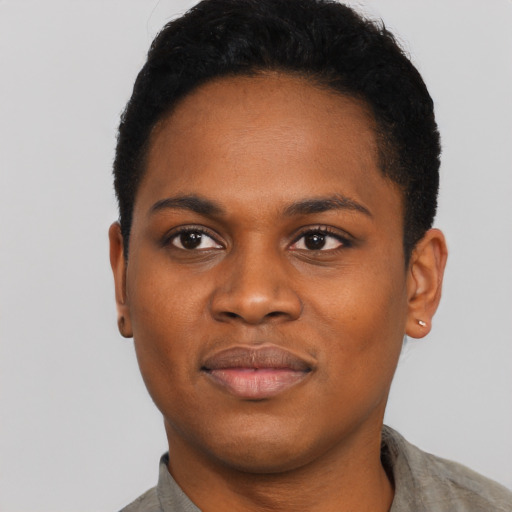 Joyful black young-adult female with short  black hair and brown eyes