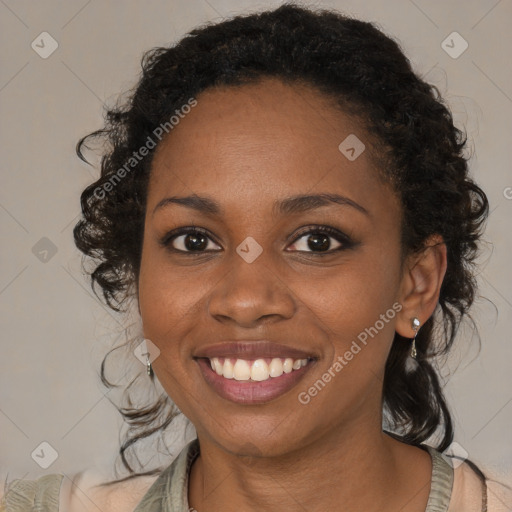 Joyful black young-adult female with medium  brown hair and brown eyes