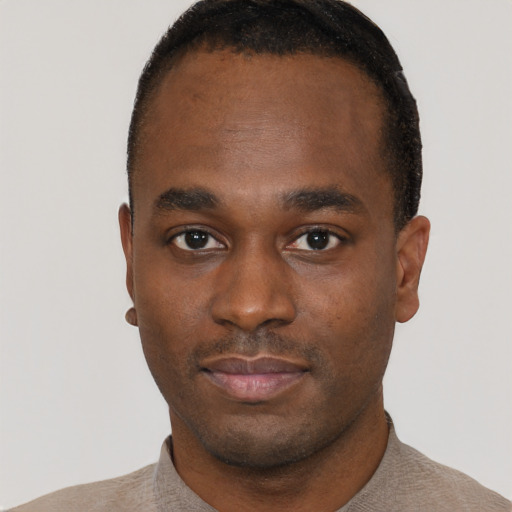 Neutral black young-adult male with short  black hair and brown eyes