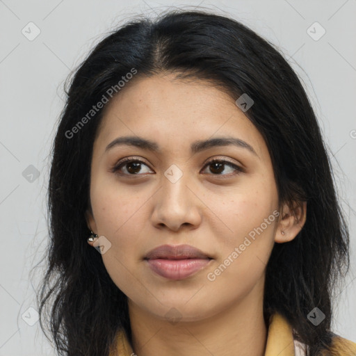 Joyful latino young-adult female with long  brown hair and brown eyes