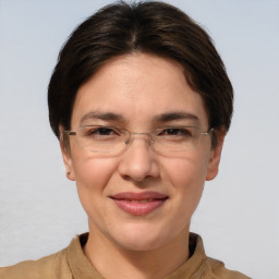 Joyful white adult female with short  brown hair and brown eyes