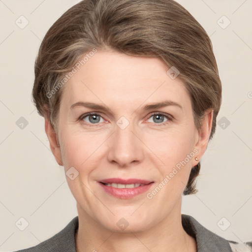 Joyful white adult female with short  brown hair and grey eyes