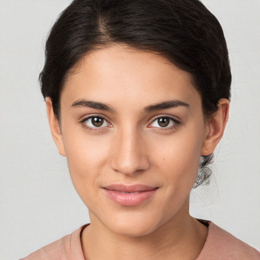 Joyful white young-adult female with medium  brown hair and brown eyes