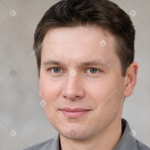 Joyful white adult male with short  brown hair and brown eyes