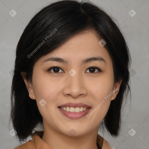 Joyful asian young-adult female with medium  brown hair and brown eyes