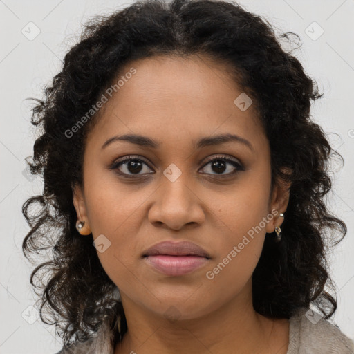 Joyful black young-adult female with long  brown hair and brown eyes