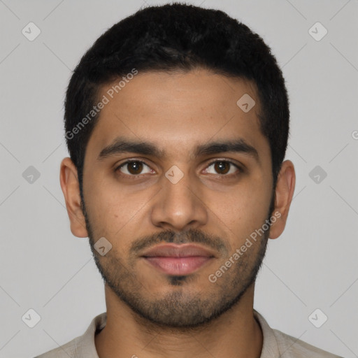 Joyful latino young-adult male with short  black hair and brown eyes