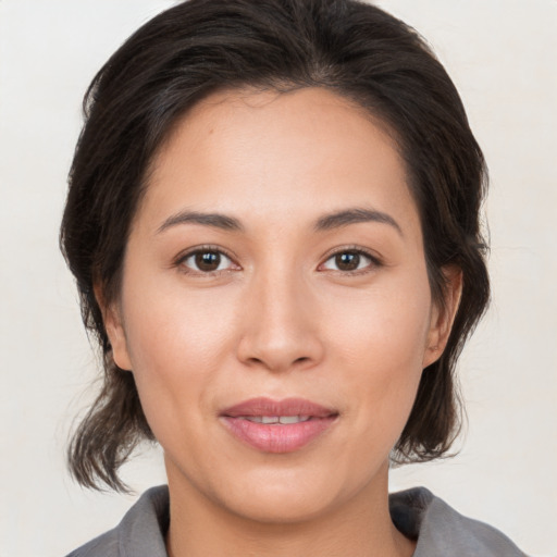 Joyful white young-adult female with medium  brown hair and brown eyes