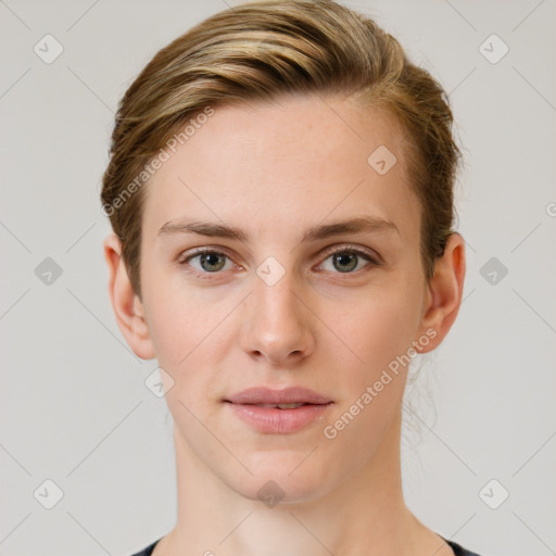 Joyful white young-adult female with short  brown hair and grey eyes