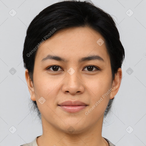 Joyful asian young-adult female with short  black hair and brown eyes