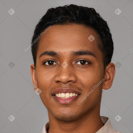 Joyful black young-adult male with short  black hair and brown eyes