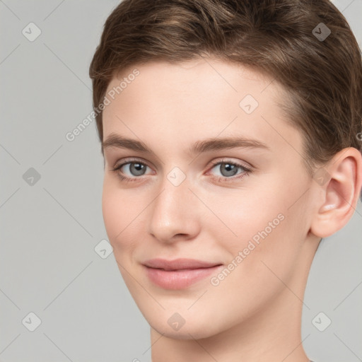 Joyful white young-adult female with short  brown hair and grey eyes