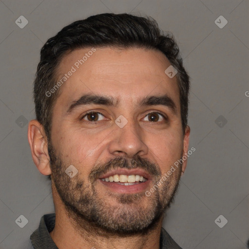 Joyful white adult male with short  black hair and brown eyes