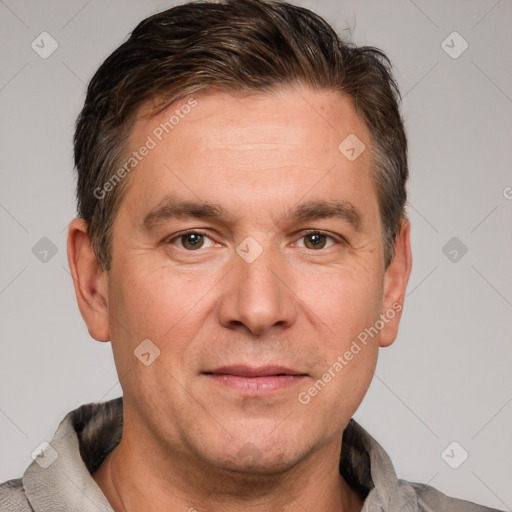 Joyful white adult male with short  brown hair and grey eyes