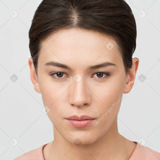 Neutral white young-adult female with short  brown hair and brown eyes