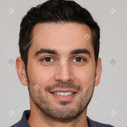 Joyful white young-adult male with short  black hair and brown eyes