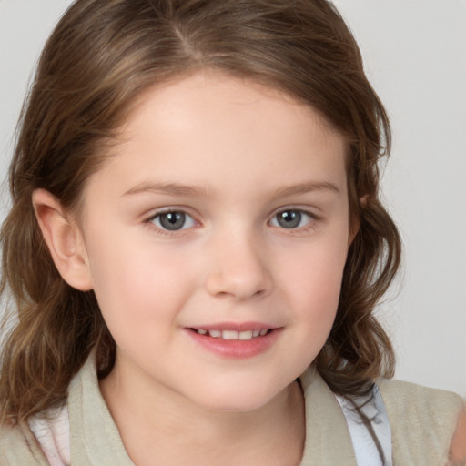 Joyful white child female with medium  brown hair and brown eyes