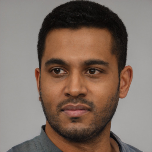 Neutral black young-adult male with short  black hair and brown eyes