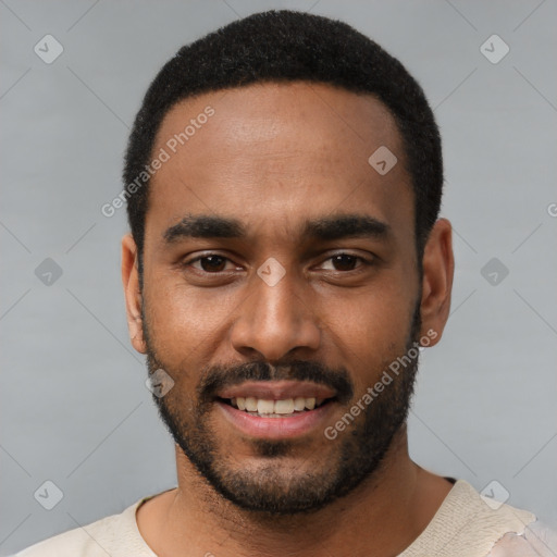 Joyful black young-adult male with short  black hair and brown eyes